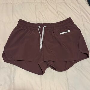 Vuori Women's Athletic Shorts in Brown